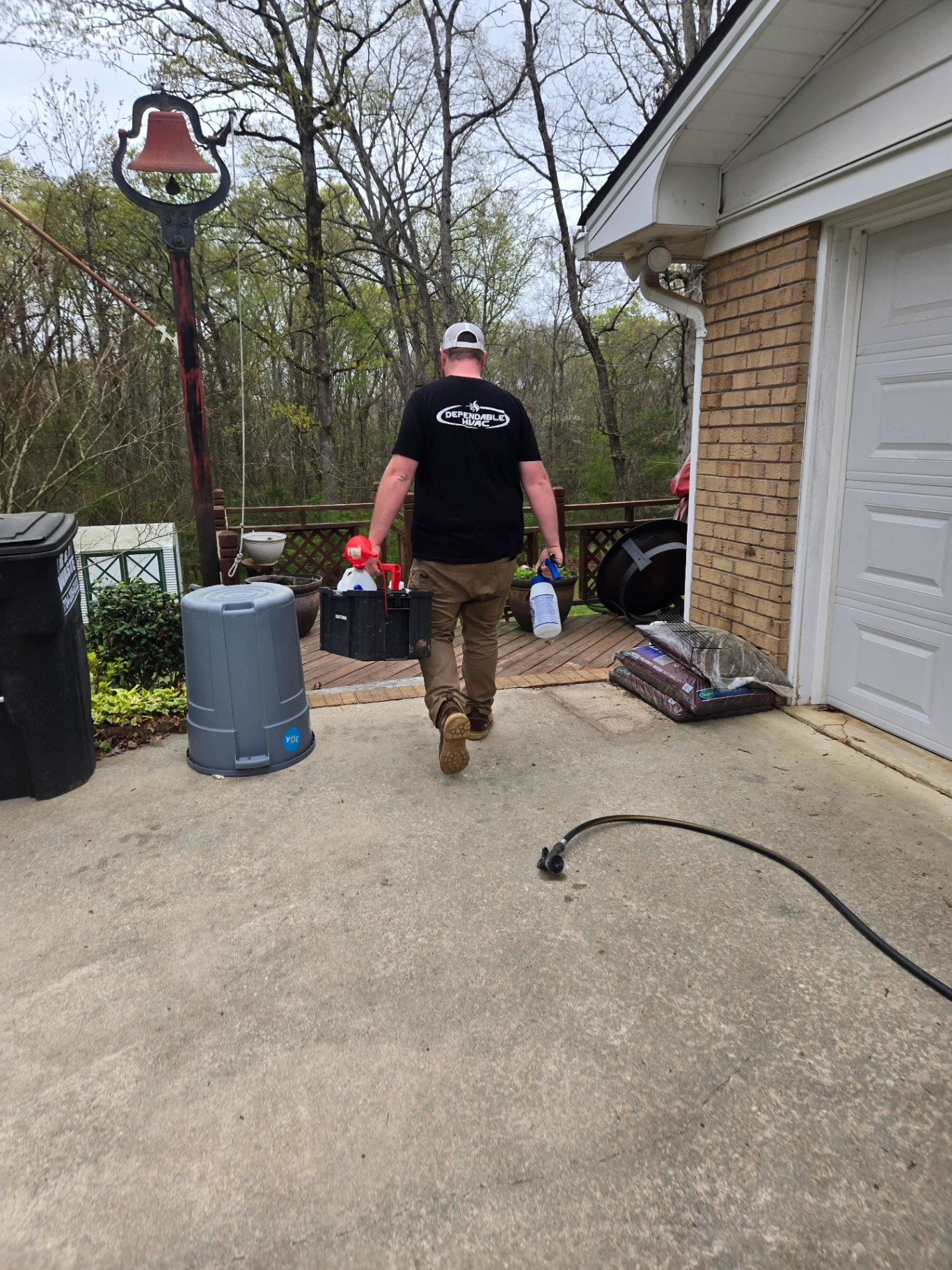 Dependable HVAC technician walking with tools in Badin NC